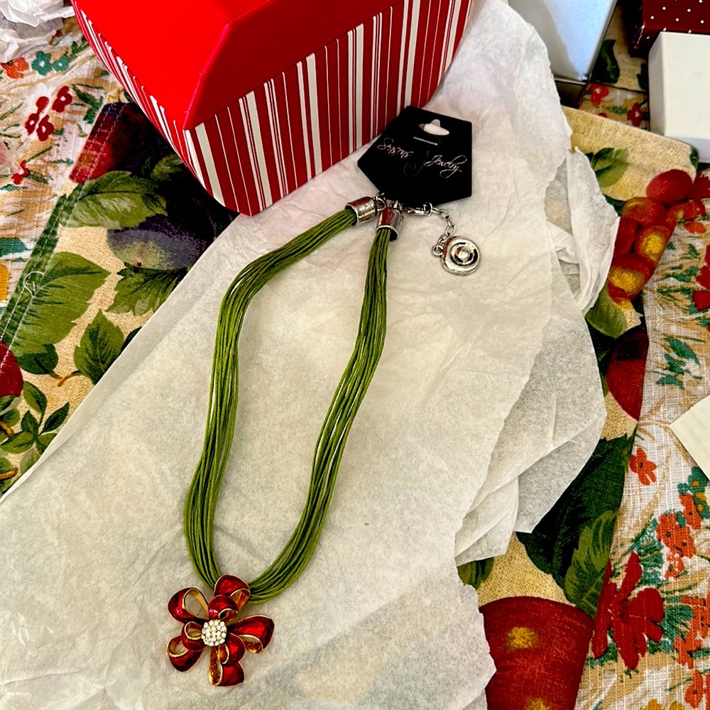 Holiday metal red poinsettia with crystals clip on pendant on nylon string chain